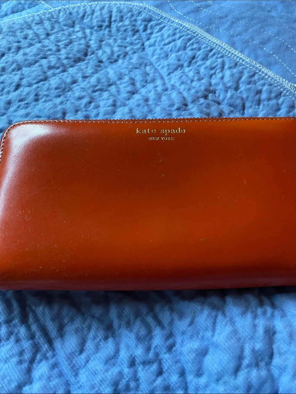 kate spade orange Leather Zip Around Wallet with Gold Logo with pink inside